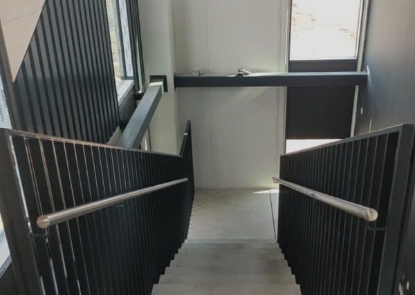 Metal handrail with armrest for staircase